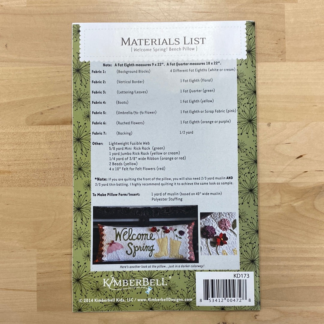 Welcome spring with this playful pattern by Kimberbell for your regular sewing machine! With appliques of umbrellas, rain boots, and dimensional flowers, this pattern will add a touch of whimsy to any bench or seat. Photo features the back of the package.