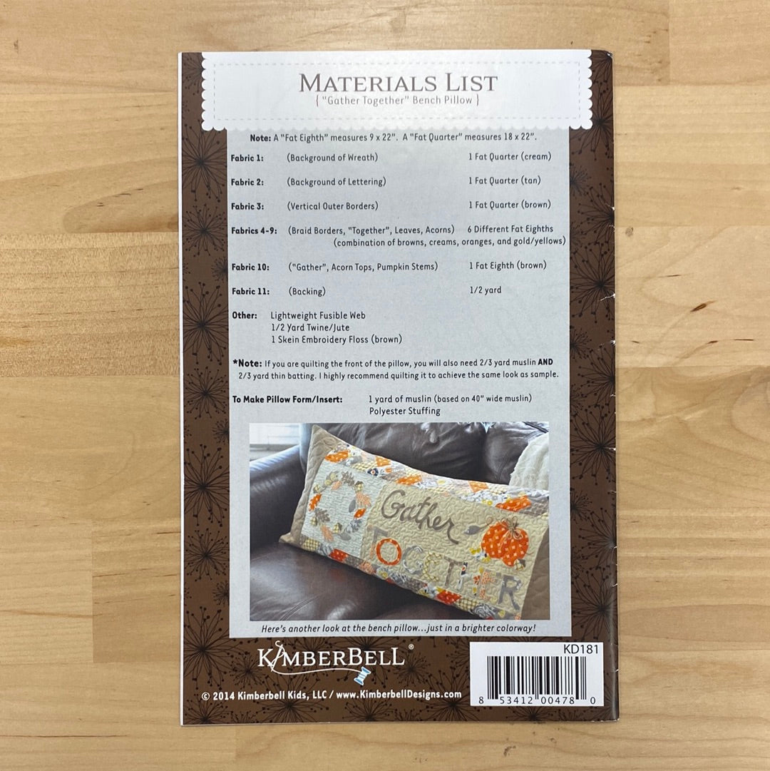 The Gather Together bench pillow pattern (KD181) by Kimberbell will help you create a festive and charming addition to your home decor. Featuring a wreath of leaves and pumpkin with the words "Gather Together", this pattern includes colorful borders and is easily appliqued on a regular sewing machine. Photo shows the back of the package.