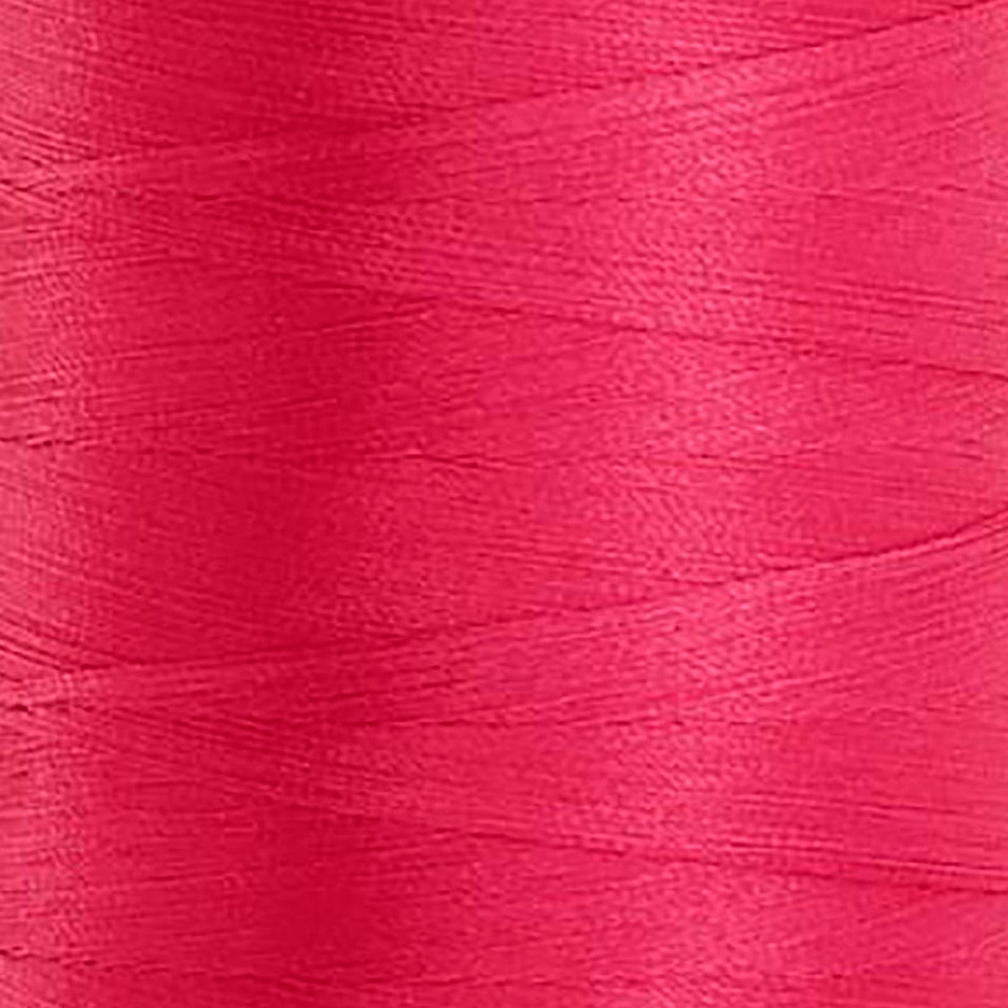 Glide Trilobal Polyester 40 wt thread in Hot Pink - 70812 - Photo shows close up detail of pink thread wound on the spool