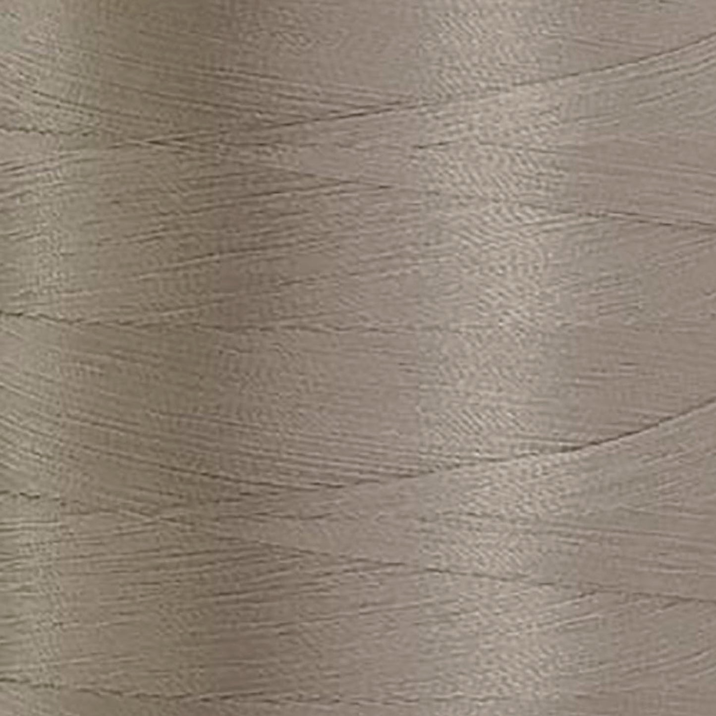 Glide 40 wt. Trilobal Polyester by Fil-Tec come in a mini spool of 1,100 yards of thread. Cool Grey 3 (10CG3) is a medium shade grey, perfect for woodland creature or construction embroidery and thread-painting. Photo shows the closeup of the thread. Stitcher's Joy
