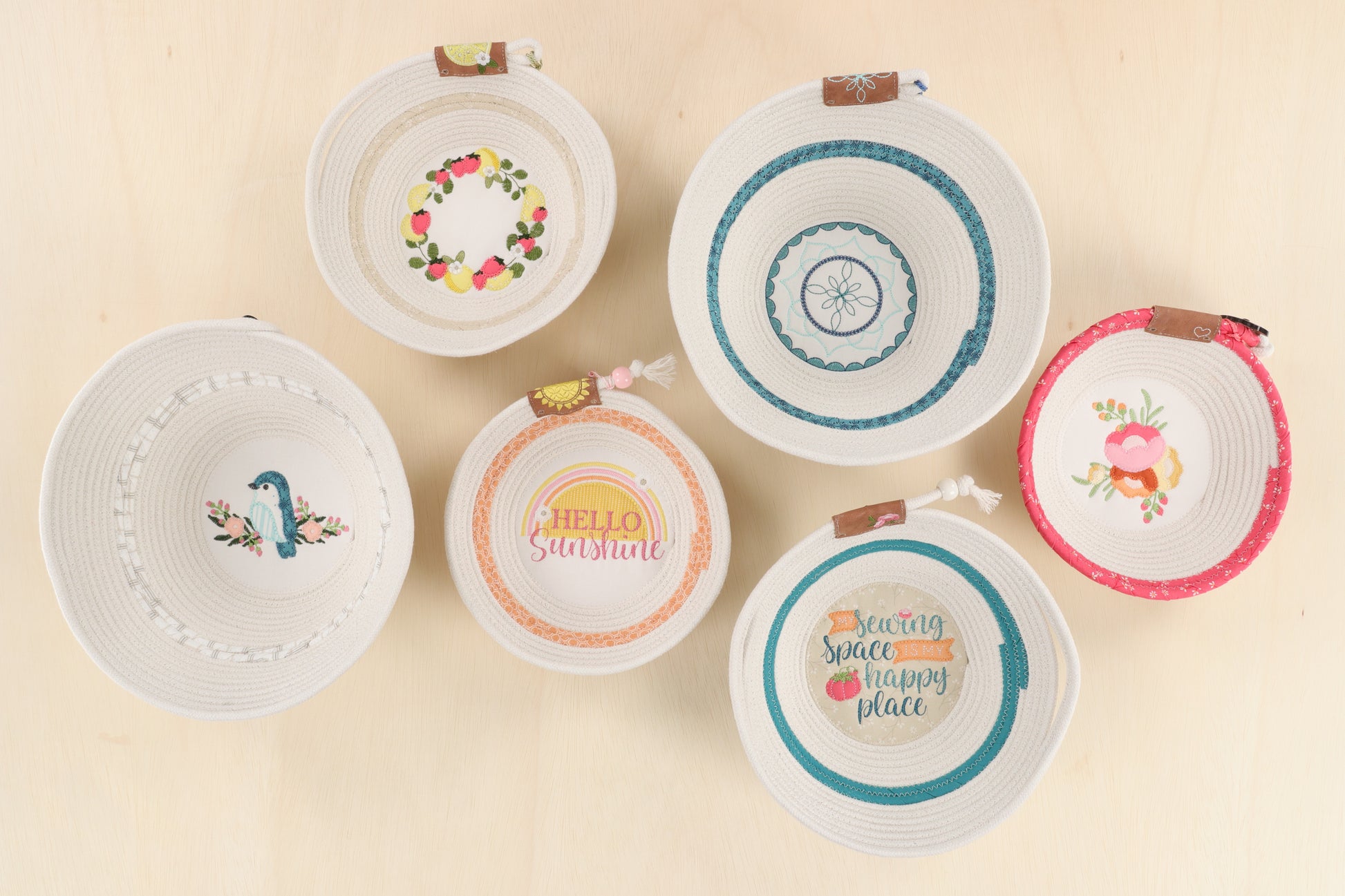 With Kimberbell’s Happy Place Embroidery Projects (KD5134), create rope bowls with 6 unique designs in multiple sizes. The photo shows an example of each finished design.