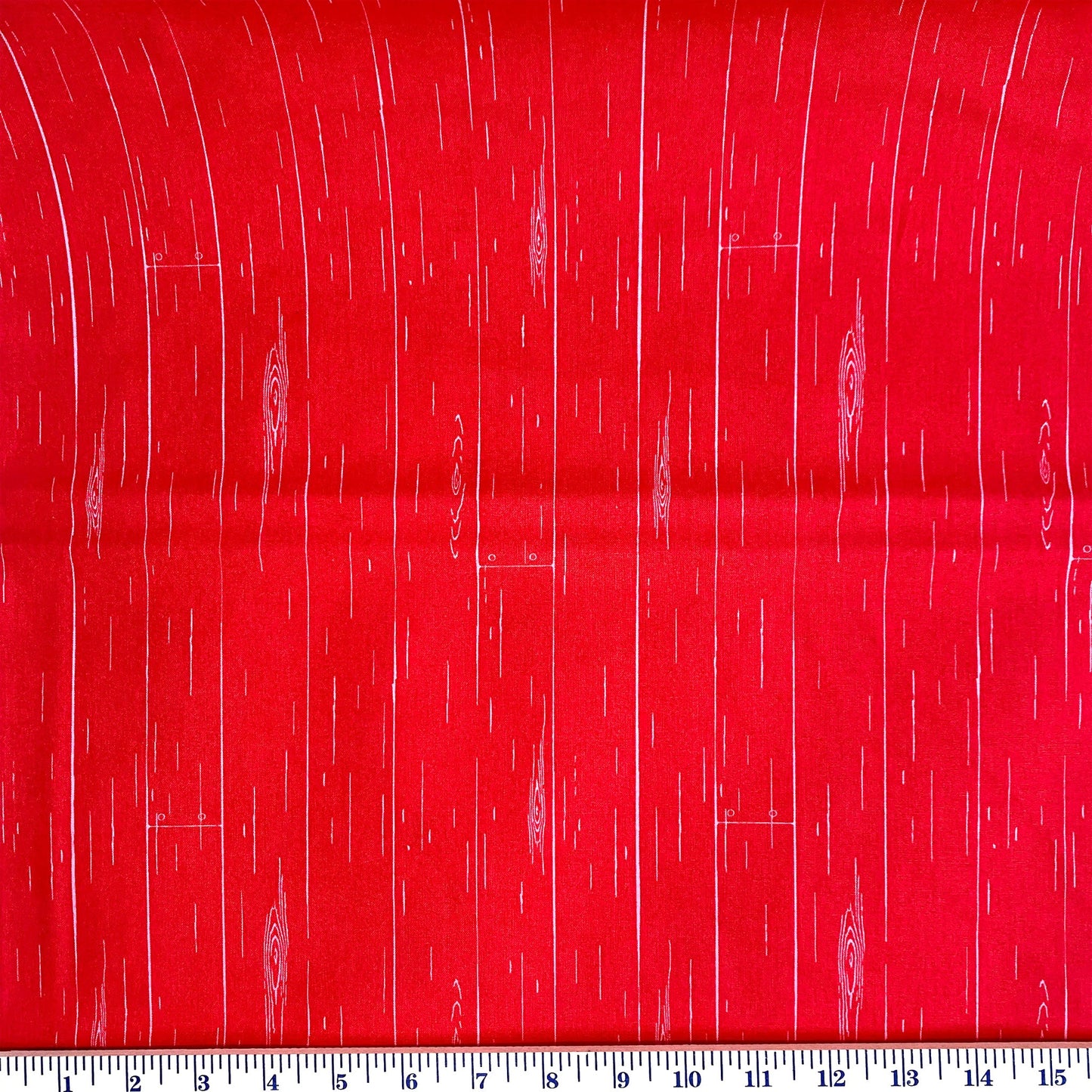 Farmhouse Floral by Nanvy Ziemen for Penny Rose Fabrics is a red fabric with a tone on tone barnwood pattern. Stitcher's Joy