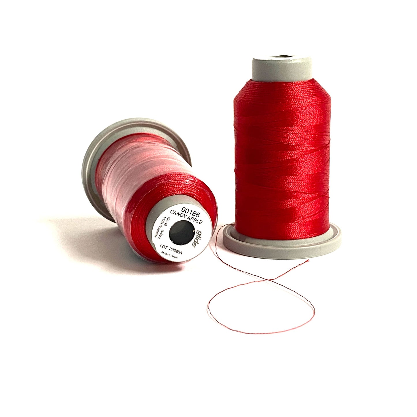 Glide 40 wt. Trilobal polyester thread by Fil-Tec is available on a 1,100 yard mini spool and this delicious Candy Apple (90186) red will have you reaching for a shiny fruit and driving your favorite classic car. This thread with it's light sheen is perfect for thread-painting and embroidery. Stitcher's Joy