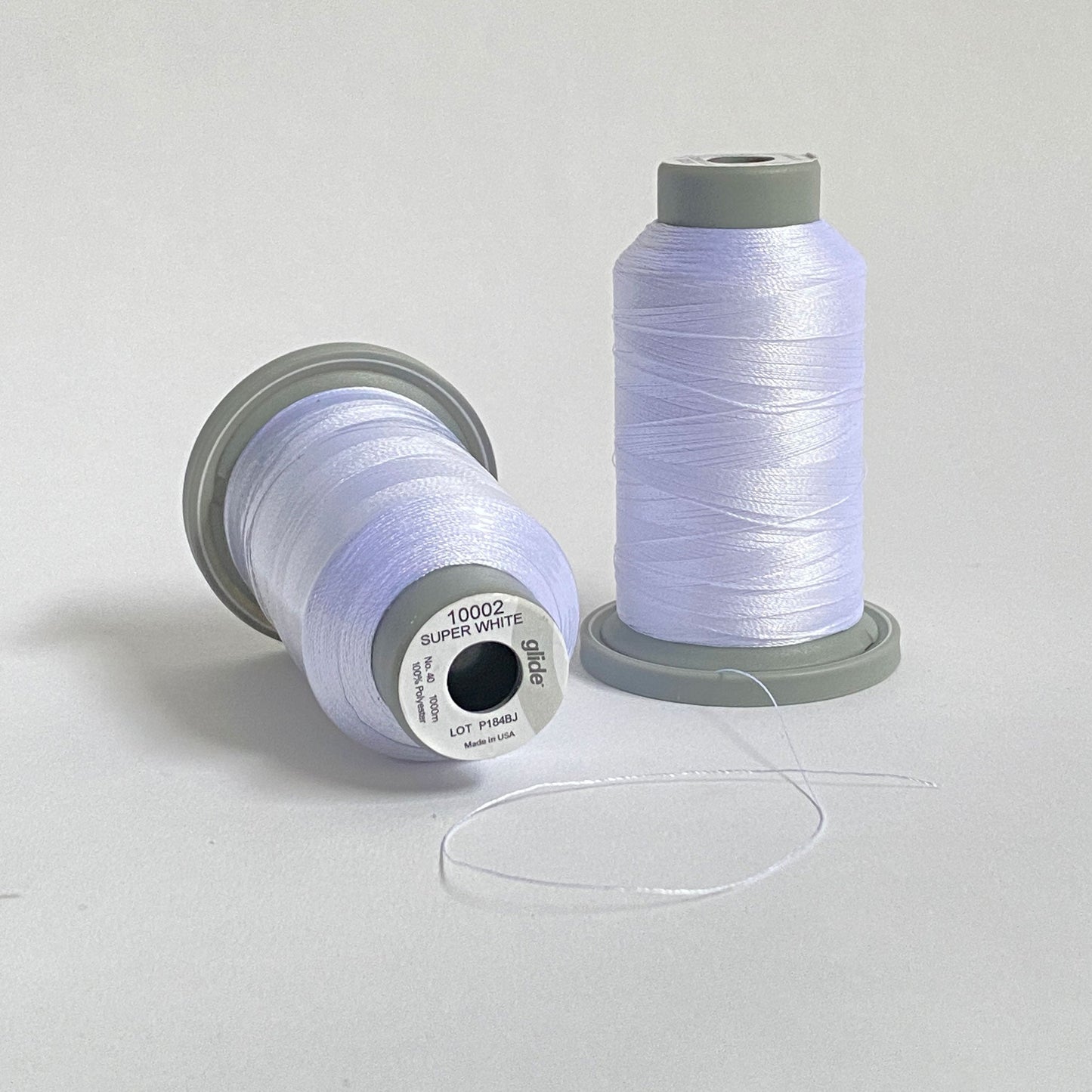 Glide 40 wt. Trilobal polyester thread by Fil-Tec offers superior coverage and strength on each 1,100 yard mini spool. Super White (10002) is a bright white and it's sheen makes it perfect for capturing glistening snow or any other pure white scene. Stitcher's Joy