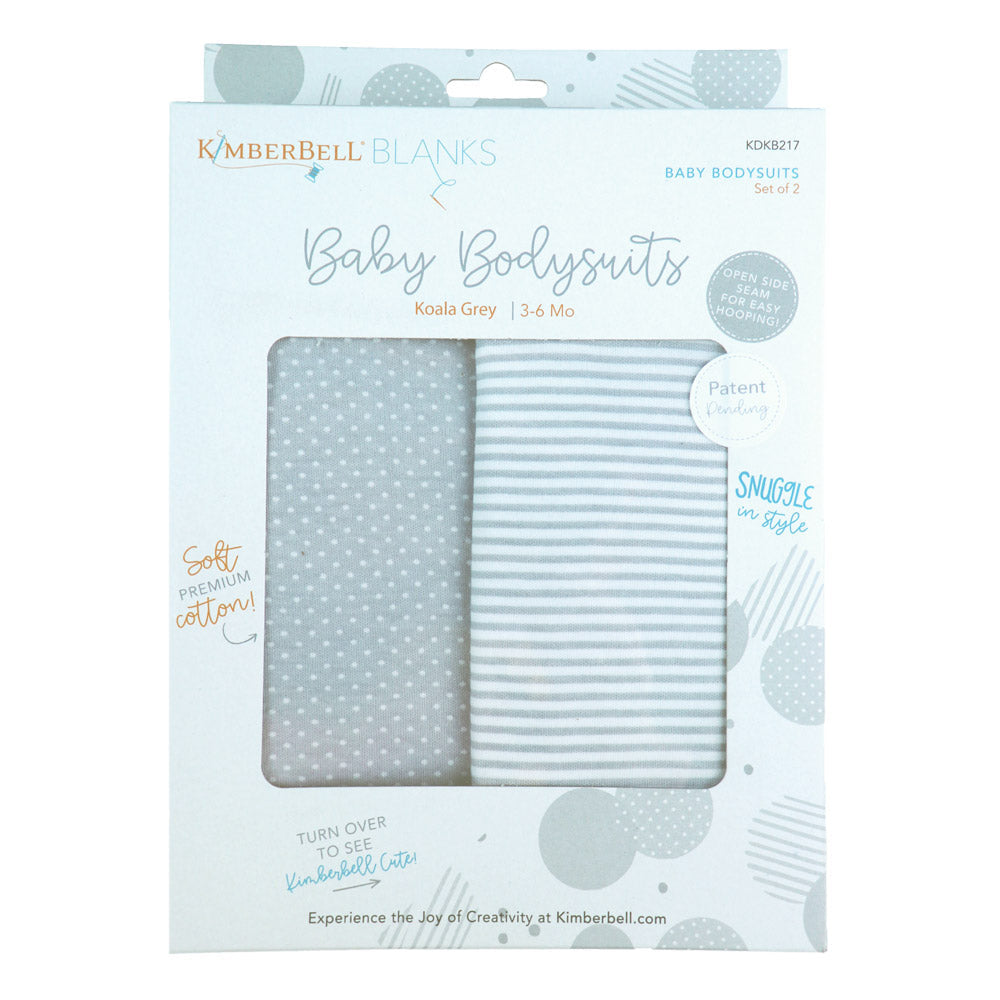 Kimberbell Baby Bodysuits are made with 100% cotton, and are available in 3 sizes of either Blushing Peach or Koala Grey. Photo Shows package of grey bodysuits, one striped and one polka dots.