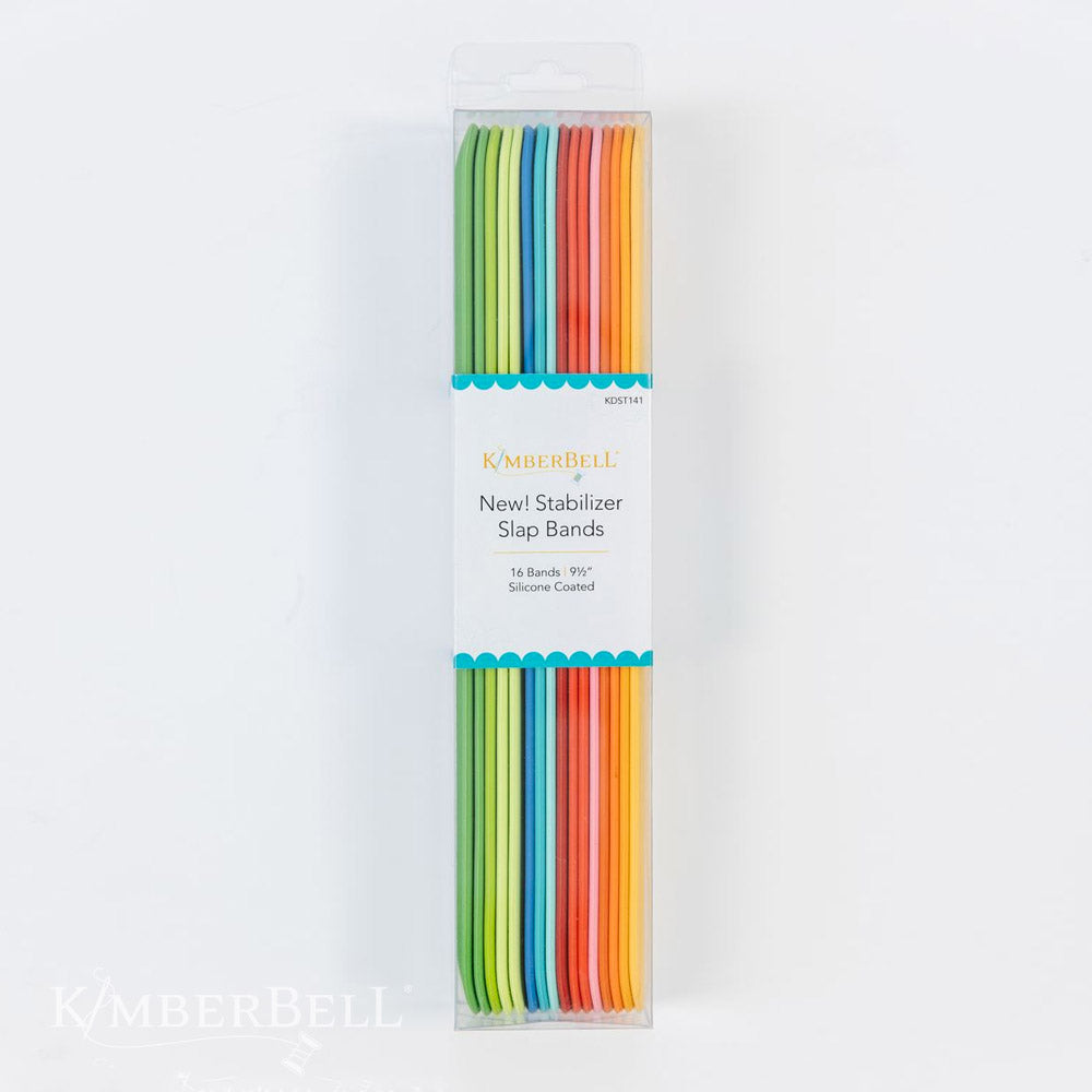 Stabilizer Slap Bands by Kimberbell (KDST141) features 16 stabilizer slap bands using Kimberbell’s color system of including Tear-Away in Red, Cut-Away in Orange, Wash-Away in Blue and Specialty products in Green. The packaging color for each type moves from lighter to darker as the weight of the stabilizer moves from lighter to heavier, making the perfect stabilizer easy to spot. This photo shows the package of 16 slap bands in their corresponding colors.