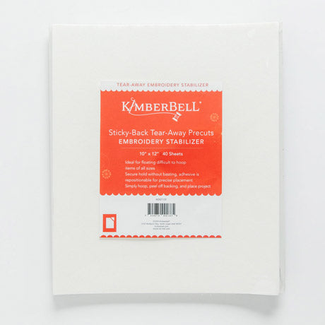 Kimberbell Sticky Back Tear Away stabilizer by Kimberbell is color-coded in a light red to reflect this is a medium weight tear away with light adhesive coating for use on hard to hoop items or with tightly woven, non-stretchable and slippery fabrics. The 10" x 12" sheets are pictured, but the stabilizer is also available in 12" x 10 yard and 20” x 5 yard rolls.