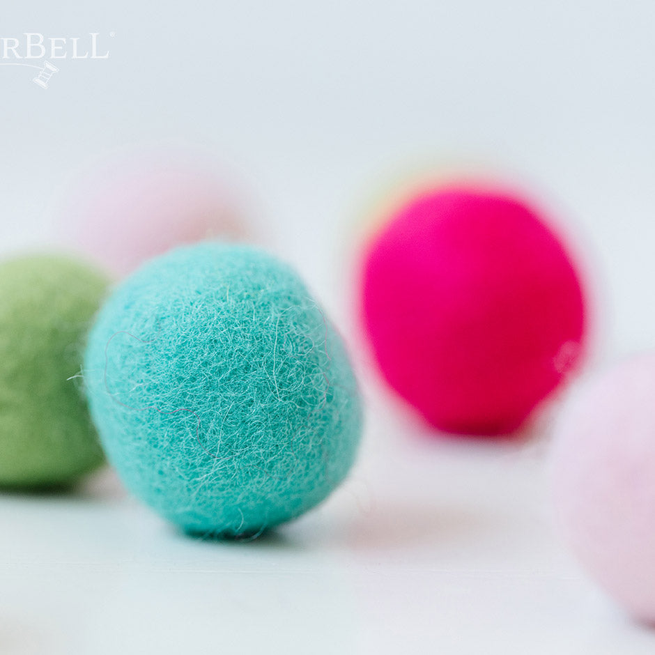 Kimberbell’s Sugar Plum Jubilee Wool Felt Balls (KDKB1214) add a dimensional pop to a variety of machine embroidery, sewing, and craft projects! Colors include Pistachio, Hawaiian Ice, Cherry Cordial, Gumdrop, Key Lime, and Taffy, with two 1.25” balls per color.