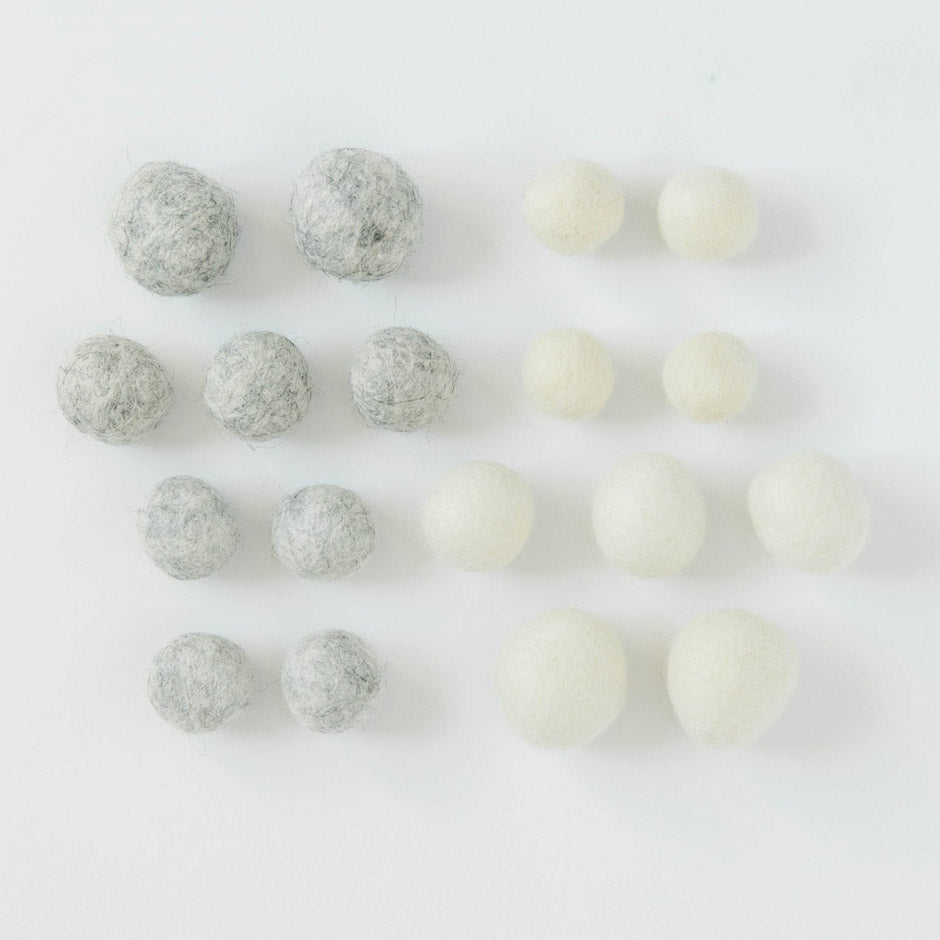 Kimberbell’s Winter Wonderland Wool Felt Balls (KDKB1215) add a pleasing dimensional pop to machine embroidery, sewing, and crafting projects! Warm colors include Buttermilk and Smoky Grey, with 18 balls of various sizes.