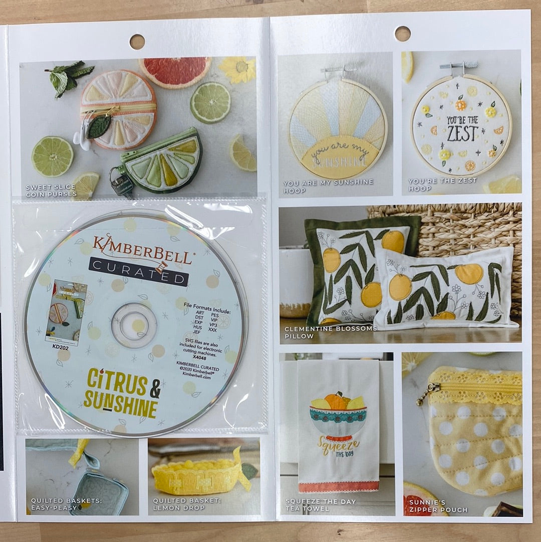 Bright, beautiful, and bursting with creativity, Kimberbell Curated: Citrus & Sunshine includes 12 fresh and fabulous machine embroidery projects. “Squeeze the Day” with a colorful tea towel, and “Be the Sunshine” with a pretty Pocket Tote! Photo shows inside over and shows CD plus pouches, baskets, and hoop designs.
