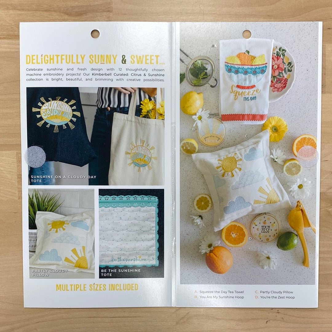 Bright, beautiful, and bursting with creativity, Kimberbell Curated: Citrus & Sunshine includes 12 fresh and fabulous machine embroidery projects. “Squeeze the Day” with a colorful tea towel, and “Be the Sunshine” with a pretty Pocket Tote! Photo shows inside of cover and features towels, totes, and pillows.