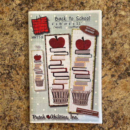 Get ready for the new school year with our Back to School mini quilt pattern by Patch Abilities (MM11-9)! This quirky applique design features a basket of books (guaranteed to impress your teacher) and an apple (the perfect gift for your favorite educator).