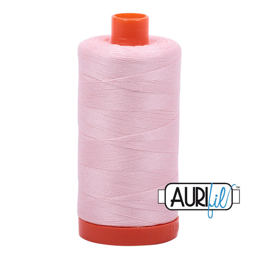 Aurifil 50 wt. cotton thread offers versatility, strength, and radiant color with very little lint on each 1,422 yard large spool.