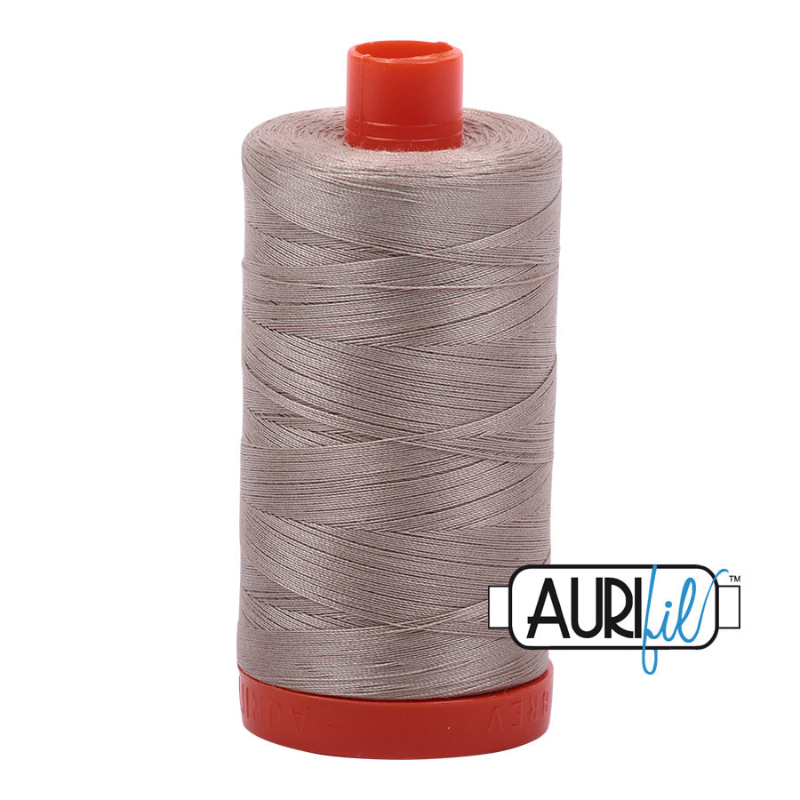 Aurifil 50 wt. cotton thread offers versatility, strength, and radiant color with very little lint on each 1,422 yard large spool.