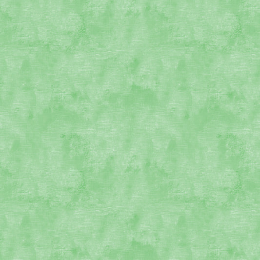 Chalk Texture 9488-43 is a light green cotton fabric with a mottled tone on tone texture with lightly brushed markings.