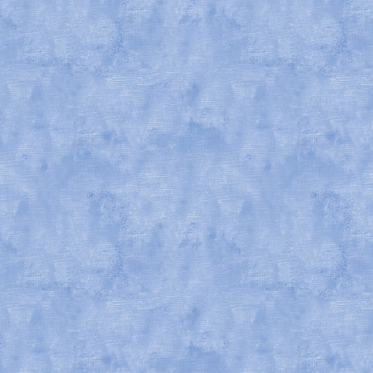 Chalk Texture 9488-53 is a light royal blue cotton fabric with a mottled tone on tone texture with lightly brushed markings.