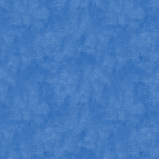 Chalk Texture 9488-54 is a royal blue cotton fabric with a mottled tone on tone texture with lightly brushed markings.