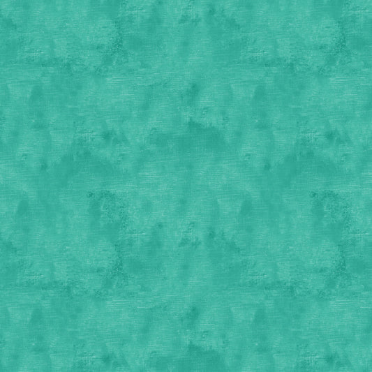 Chalk Texture 9488-81 is a turquoise cotton fabric with a mottled tone on tone texture with lightly brushed markings.