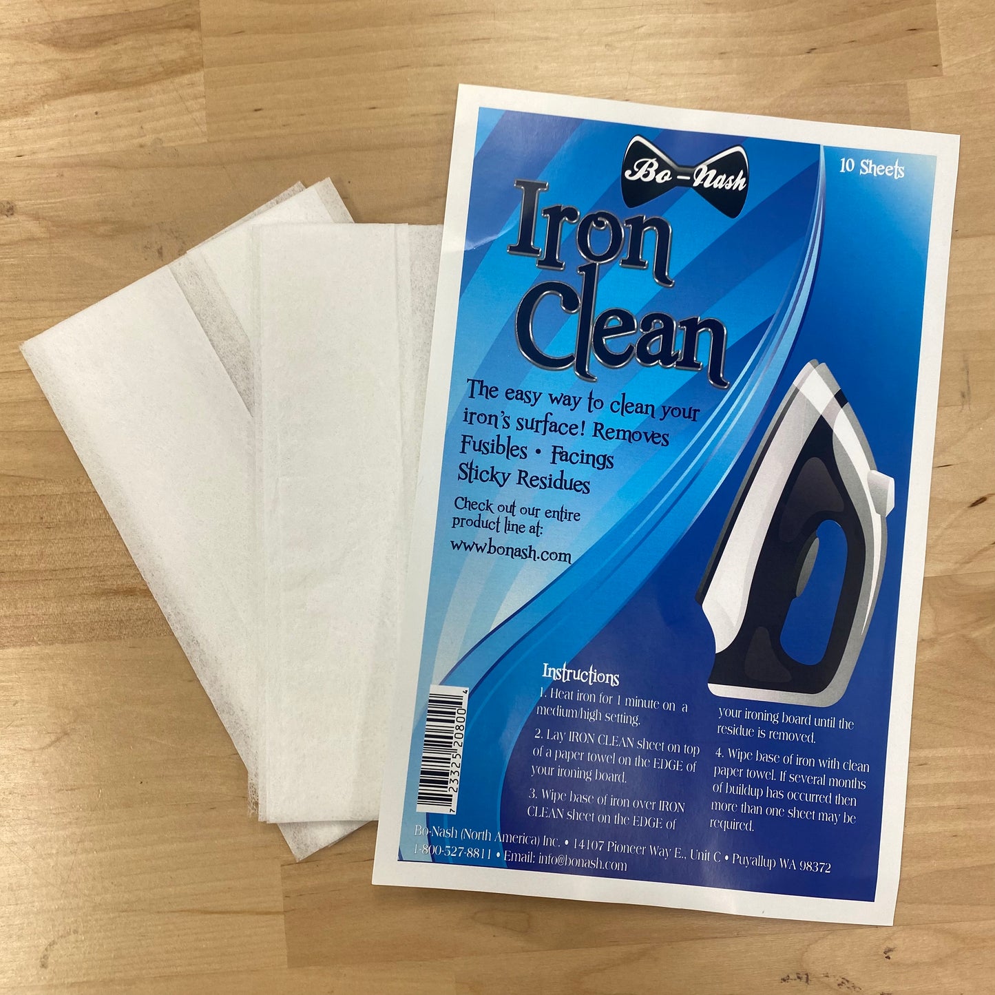 Iron Clean sheets with packaging on a wooden surface