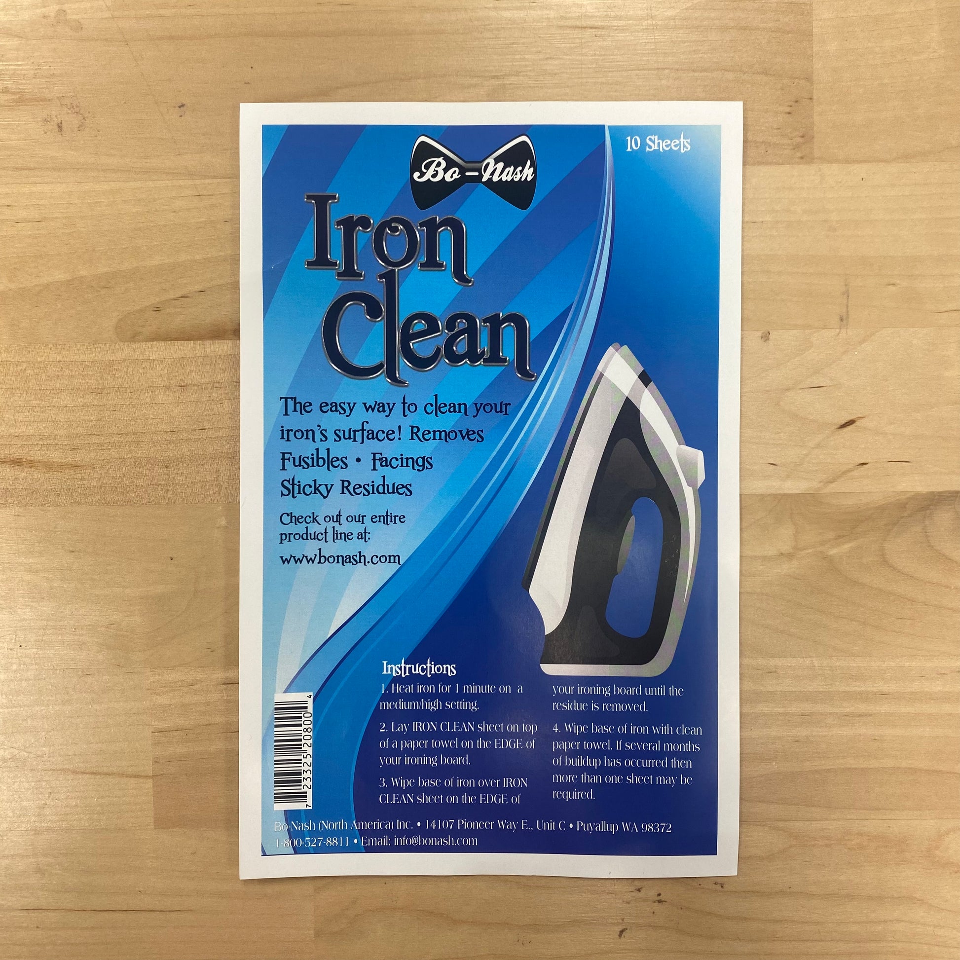 Be-Nash Iron Clean product packaging on a wooden surface