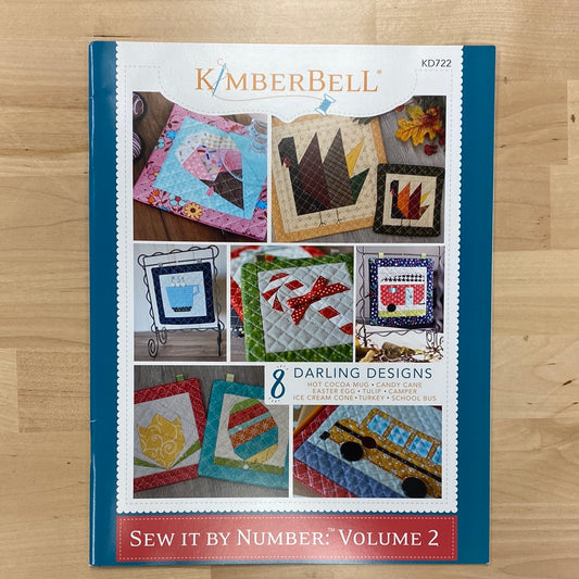 If you love paper-piecing or want to learn it for the first time, this book is for you! The monthly projects are perfect for pin cushions, mug rugs, hot pade, shelf pillows, mini quilts, and more! Pattern also includes and easy, no-fail method for quilting each block. Photo shows product front.