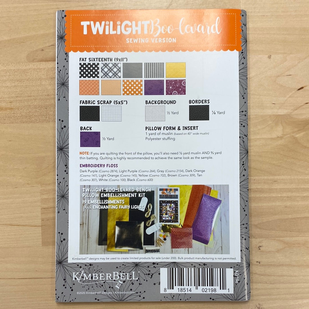 Treat yourself this Halloween with our Twilight Boo-levard Bench Pillow pattern (KD196) by Kimberbell! Featuring a spooky tree, embellished with lights, and designs from Candy Corn Quilt Shoppe and Broomhilda's Bakery. Photo shows product back.