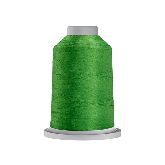 Glide 40 wt. Trilobal polyester thread by Fil-Tec offers superior coverage in each 1,100 yard mini spool. Turf (60362) is a universal green in a bright shade. The photo shows the spool. Stitcher's Joy