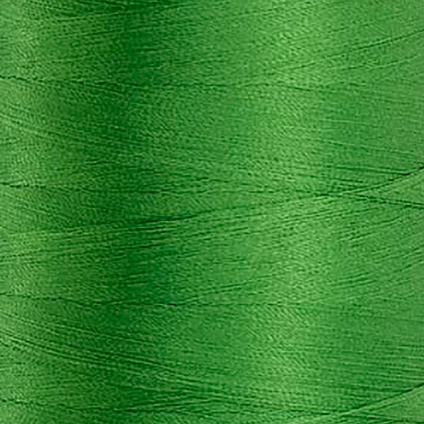 Glide 40 wt. Trilobal polyester thread by Fil-Tec offers superior coverage in each 1,100 yard mini spool. Turf (60362) is a universal green in a bright shade. The photo shows the thread detail. Stitcher's Joy
