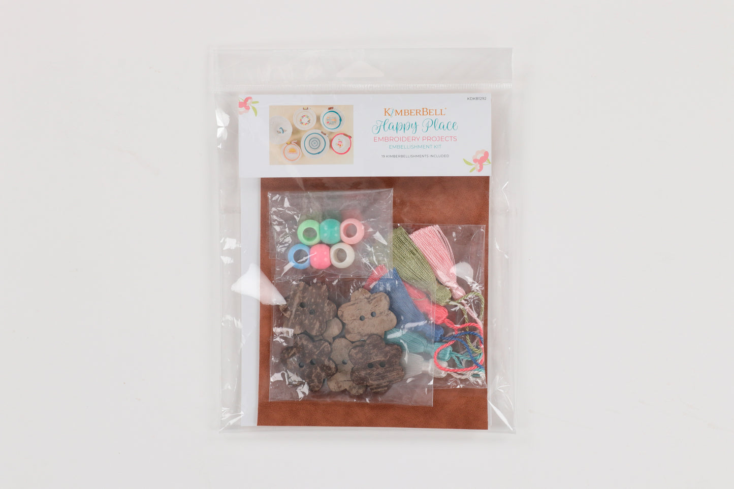 With the Happy Place Embroidery Projects Embellishment Kit (KDKB1292), create stunning gifts and decor with leather, tassels, and beautiful beads! Photo shows front of package.