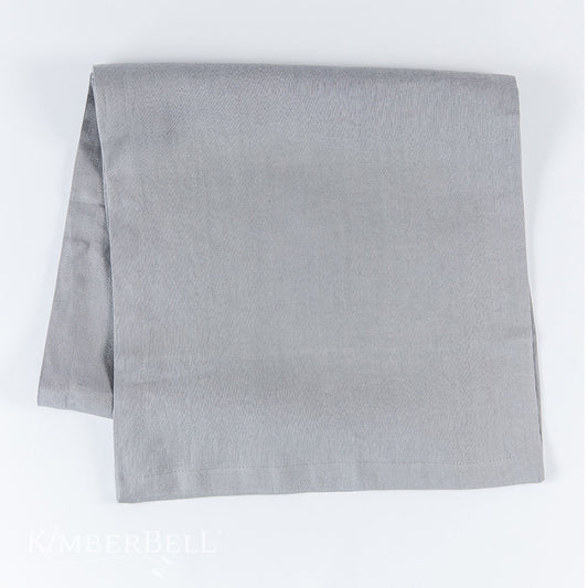 Add a homey touch to your table with Kimberbell Linen Napkin Table-runner (KDMR143)! Add a tasteful touch to your home decor with a 54 x 14” <b data-mce-fragment="1">Linen Table Runner!</b> Made from a beautiful blend of linen, cotton, and rayon, this embroiderable blank comes in a classic cool grey color. Photo shows the blank.