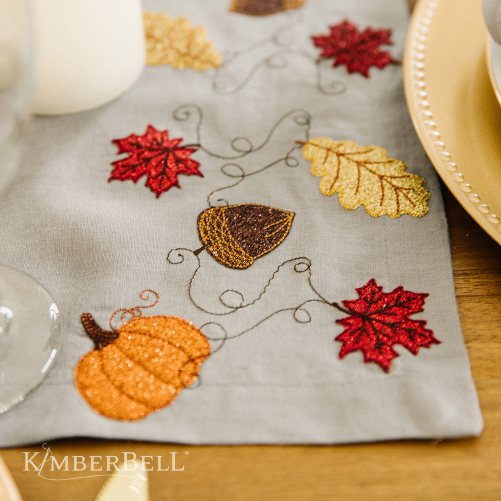 Add a homey touch to your table with Kimberbell Linen Napkin Table-runner (KDMR143)! Add a tasteful touch to your home decor with a 54 x 14” <b data-mce-fragment="1">Linen Table Runner!</b> Made from a beautiful blend of linen, cotton, and rayon, this embroiderable blank comes in a classic cool grey color. Photo shows the embroidered runner.