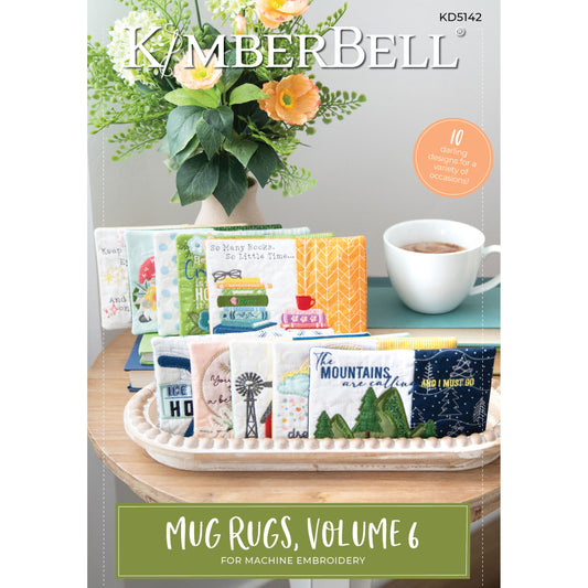 Kimberbell Mug Rug Vol 6 (KD5142) offers new themed mug rugs, such as mountains, books, windmills and more. This photo shows the front cover of the product.