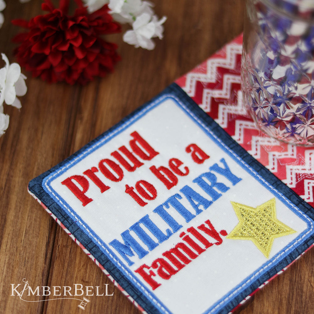 Kimberbell Mug Rug pattern for machine embroidery features small projects with fun sayings to liven up a desk or table. This photo shows Military pattern stitched out, and says the words Proud to be a Military Family with a machine appliqued star on it.