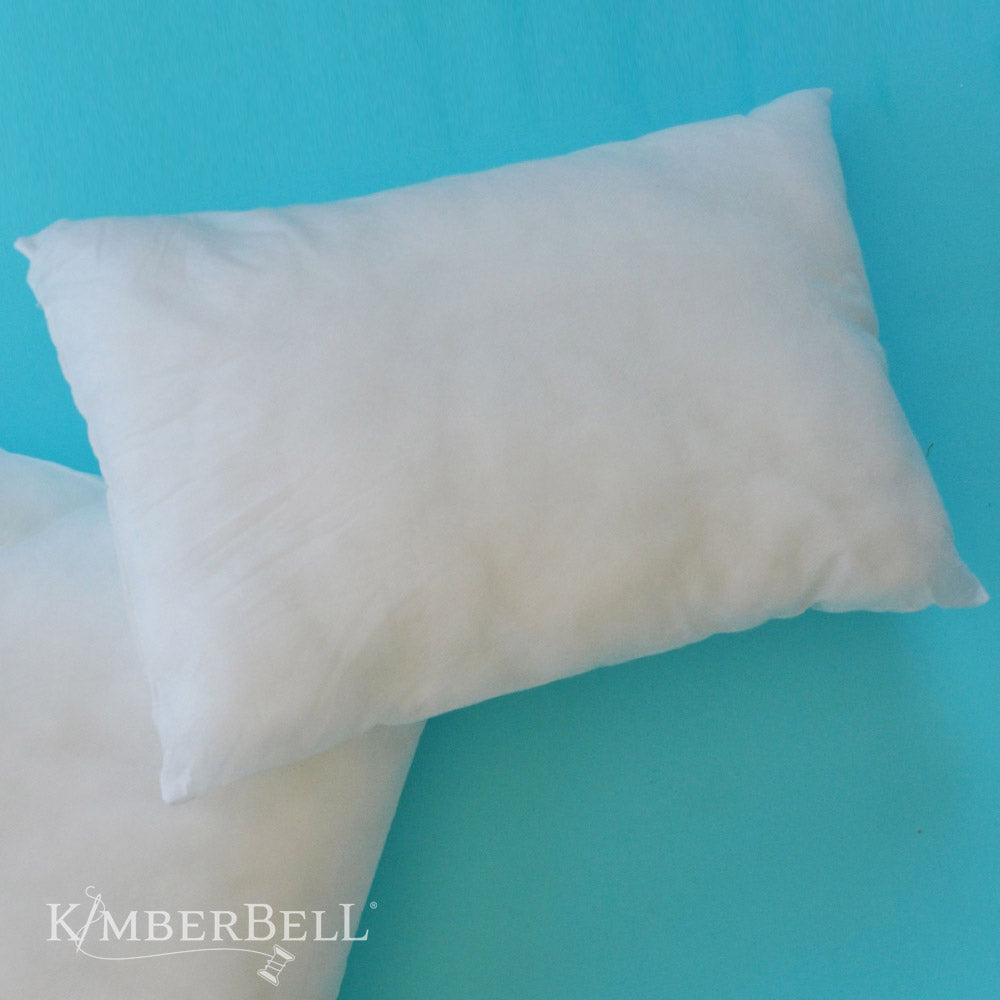 Elevate your home decor with the 12" ×18” Pillow Insert (KDKB250) by Kimberbell! Insert inside your favorite cover or change covers based on your decor, mood, or the season. Pillow arrived in a compressed package, but easily fluffs to it's full size. Photo shows fluffed pillow.
