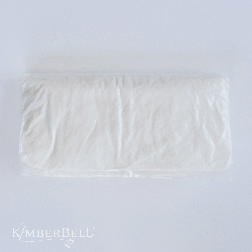 Elevate your home decor with the 12" ×18” Pillow Insert (KDKB250) by Kimberbell! Insert inside your favorite cover or change covers based on your decor, mood, or the season. Pillow arrived in a compressed package, but easily fluffs to it's full size. Photo shows compressed pillow in the packaging.
