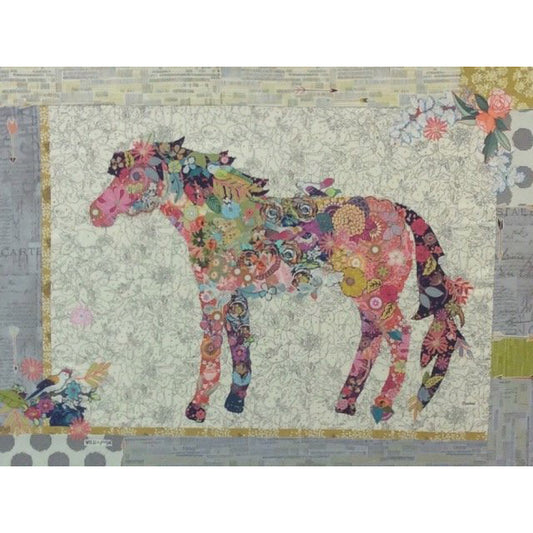 This bright and cheerful Confetti Collage Pattern by Laura Heine will prance its way onto your wall! Featuring a delightful horse amidst playful colors, this pattern will turn any room into a fun and vibrant haven. The photo shows the finished project.