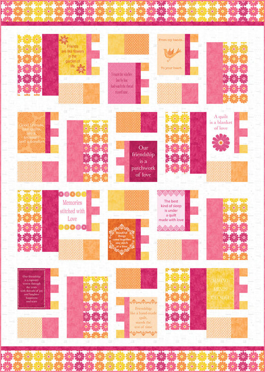 Quilt kit sample in the pink, orange, and yellow colorway. It is a patchwork quilt incorporating the panel, ombre border, and colored solids on a white background.