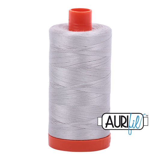 Aurifil 50 wt. cotton thread offers versatility, strength, and radiant color with very little lint on each 1,422 yard large spool. Aluminum (2615) gray is a light, clear gray. Stitcher's Joy