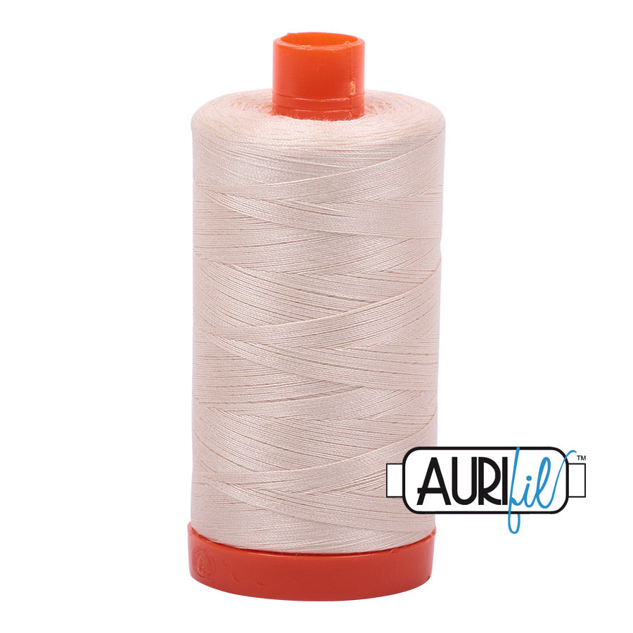 Aurifil 50 wt. cotton thread offers versatility, strength, and radiant color with very little lint on each 1,422 yard large spool. Light Sand (2000) is a light cream with brown to yellow undertones.
