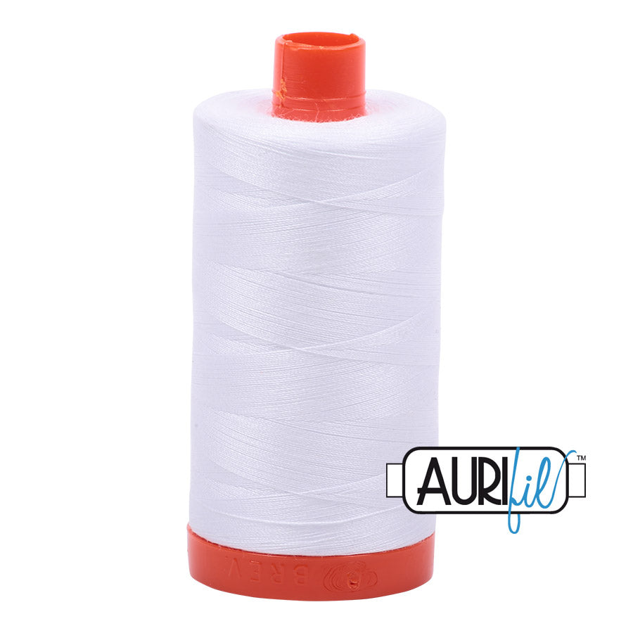 Aurifil 50 wt. cotton thread offers versatility, strength, and radiant color with very little lint on each 1,422 yard large spool. White (2024) is a general purpose white, but not a super bright white. Stitcher's Joy