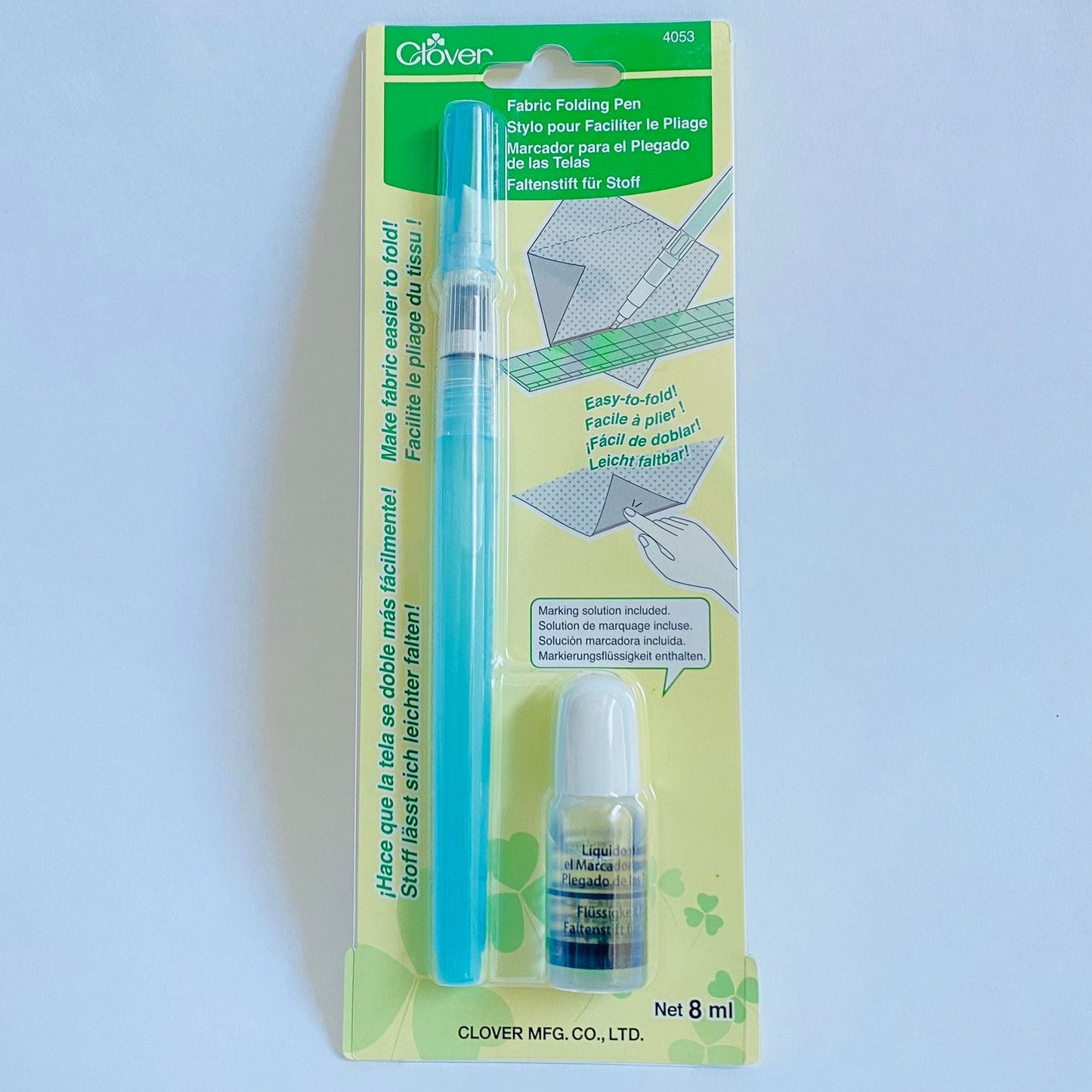 The Fabric Folding Pen by Clover in the package with special applicator tip comes with a small bottle of solution. The applicator tip dispenses the diluted solution in a fine or heavy line and makes fabric easier to fold. Use for finger pressing seams, English paper piecing, foundation or paper piecing, and more.
