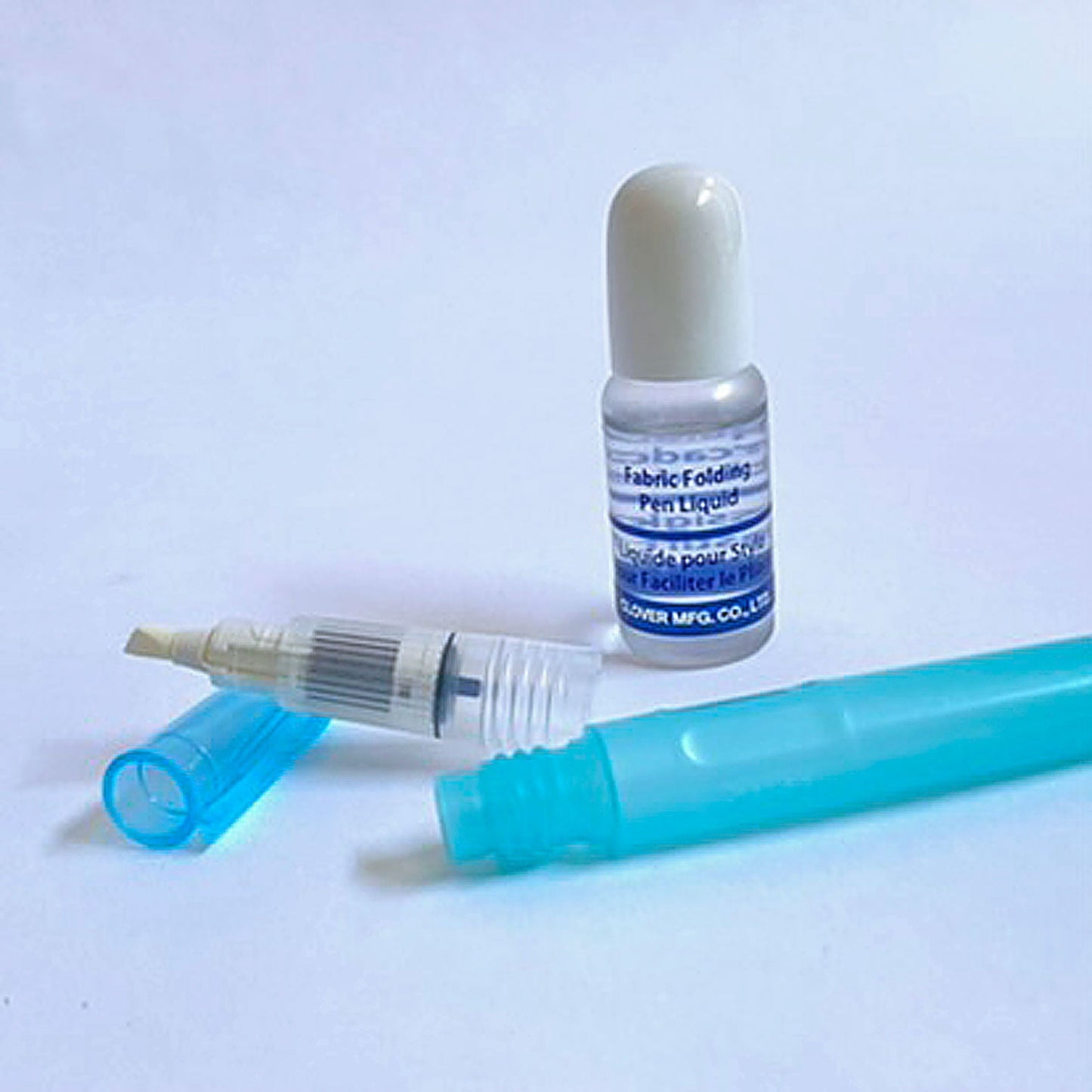 The Fabric Folding Pen by Clover with special applicator tip comes with a small bottle of solution. The applicator tip detaches from the base for adding 4-5 drops of solution plus water and then dispenses the diluted solution making fabric easier to fold. Use for finger pressing seams, English paper piecing, foundation or paper piecing, and more.