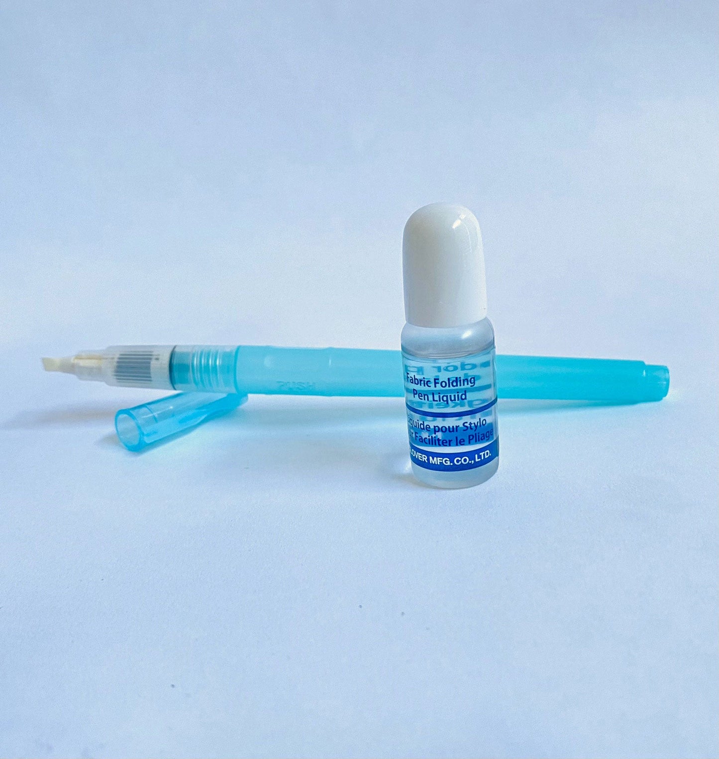 The Fabric Folding Pen by Clover with special applicator tip comes with a small bottle of solution. The applicator tip dispenses the diluted solution in a fine or heavy line and makes fabric easier to fold. Use for finger pressing seams, English paper piecing, foundation or paper piecing, and more.