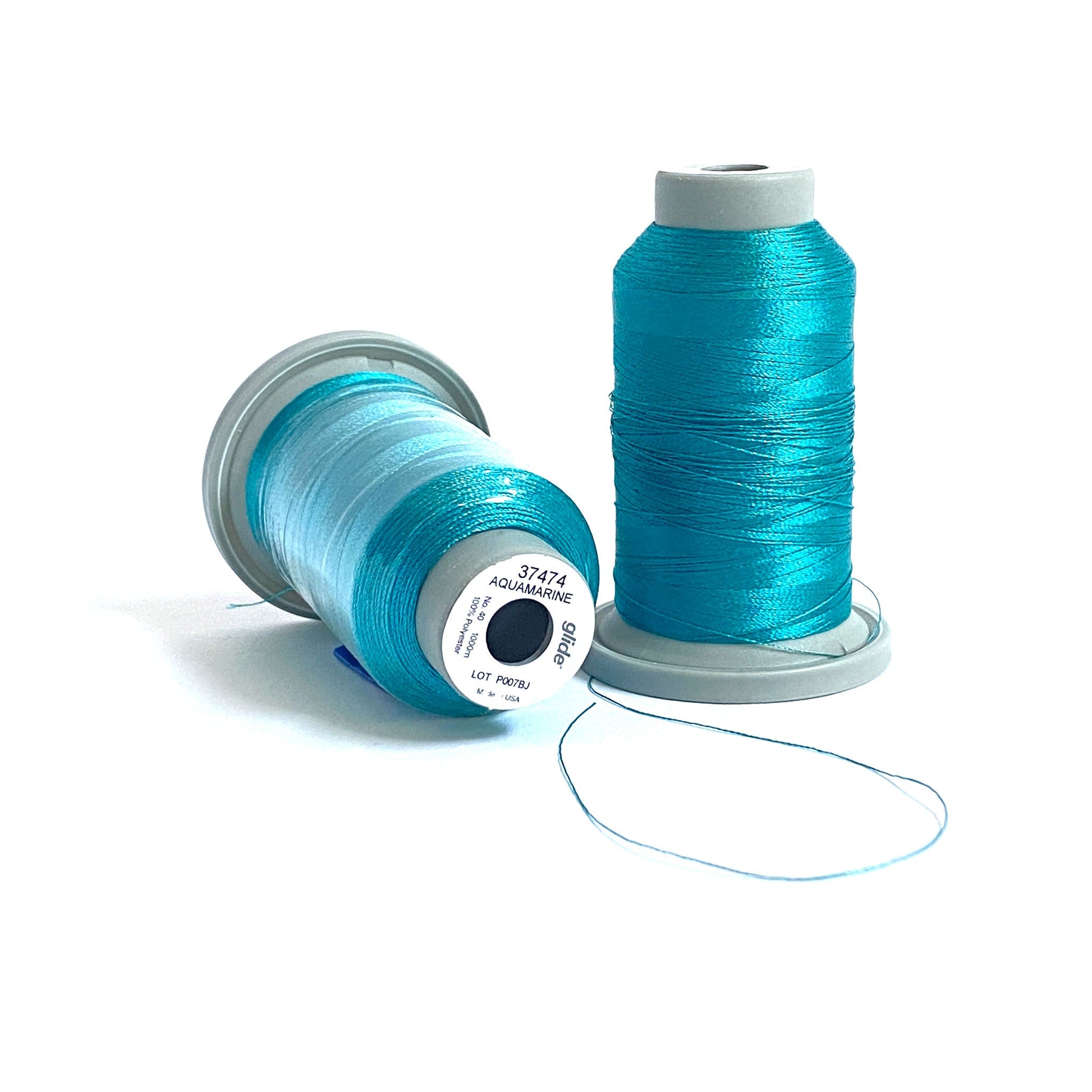 Glide 40 wt. Trilobal polyester thread by Fil-Tec offers superior coverage in each 1,100 yard mini spool. Aquamarine (37474) is a brightly aqua, and is perfect for depicting sea life or Mediterranean waters in embroidery or thread-painting. Stitcher's Joy