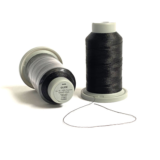Glide 40 wt. TRilobal polyester thread offers superior coverage and consistency for thread-painting and embroidery in each 1,100yd mini spool. This is a true black, and is perfect for any application. Stitcher's Joy