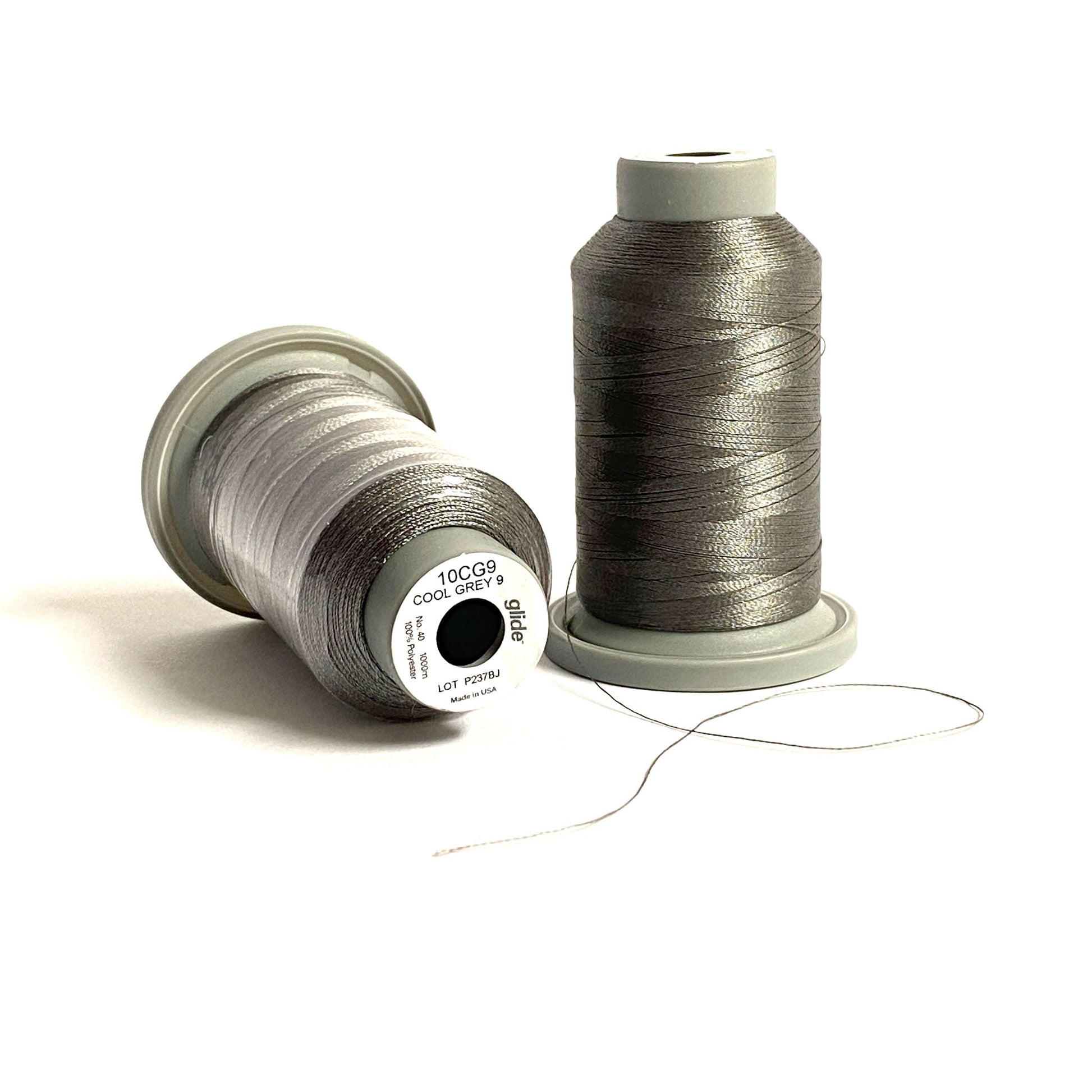 Glide 40 wt. Trilobal Polyester by Fil-Tec come in a mini spool of 1,100 yards of thread. Cool Grey 9 (10CG9) is a medium shade grey, perfect for woodland creature or construction embroidery and thread-painting. Stitcher's Joy