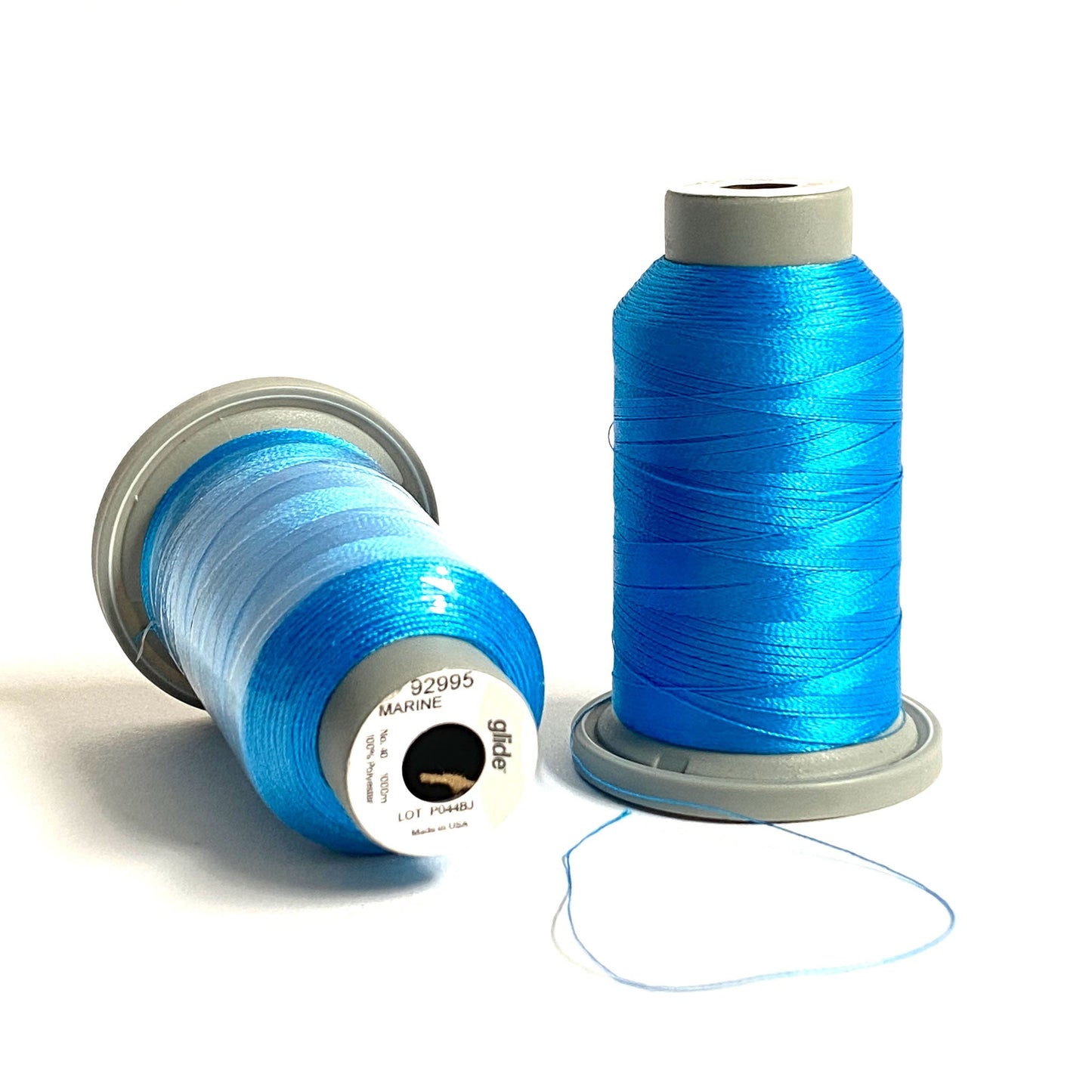 Glide 40 wt. Trilobal polyester thread by Fil-Tec has a light sheen and superior strength for embroidery and thread-painting. Marine (92995) is a rich shade of blue, reminiscent of the clear blue skies over the ocean. Stitcher's Joy