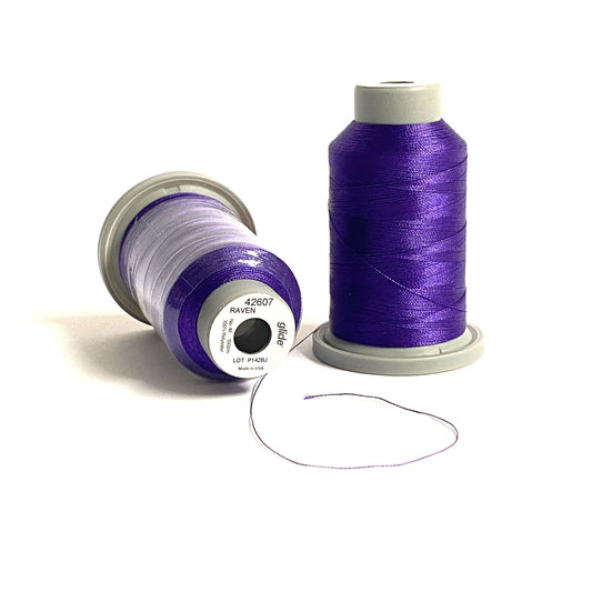 Glide 40 wt. Trilobal Polyester 1,100 yard mini spool in Raven (42607) by Fil-Tec is a bright purple thread, and perfect for Halloween or Mardi Gras, and any embroidery need. Stitcher's Joy