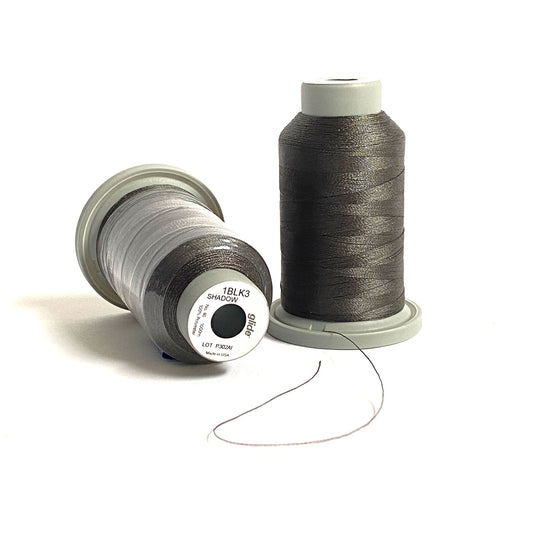 Glide 40 wt Trilobal Polyester Thread by Fil-Tec is a strong thread with a slight sheen, perfect for thread-painting and embroidery. Shadow (1BLK3) is a dark gray, which is almost a charcoal color and is perfect as an alternative to black.