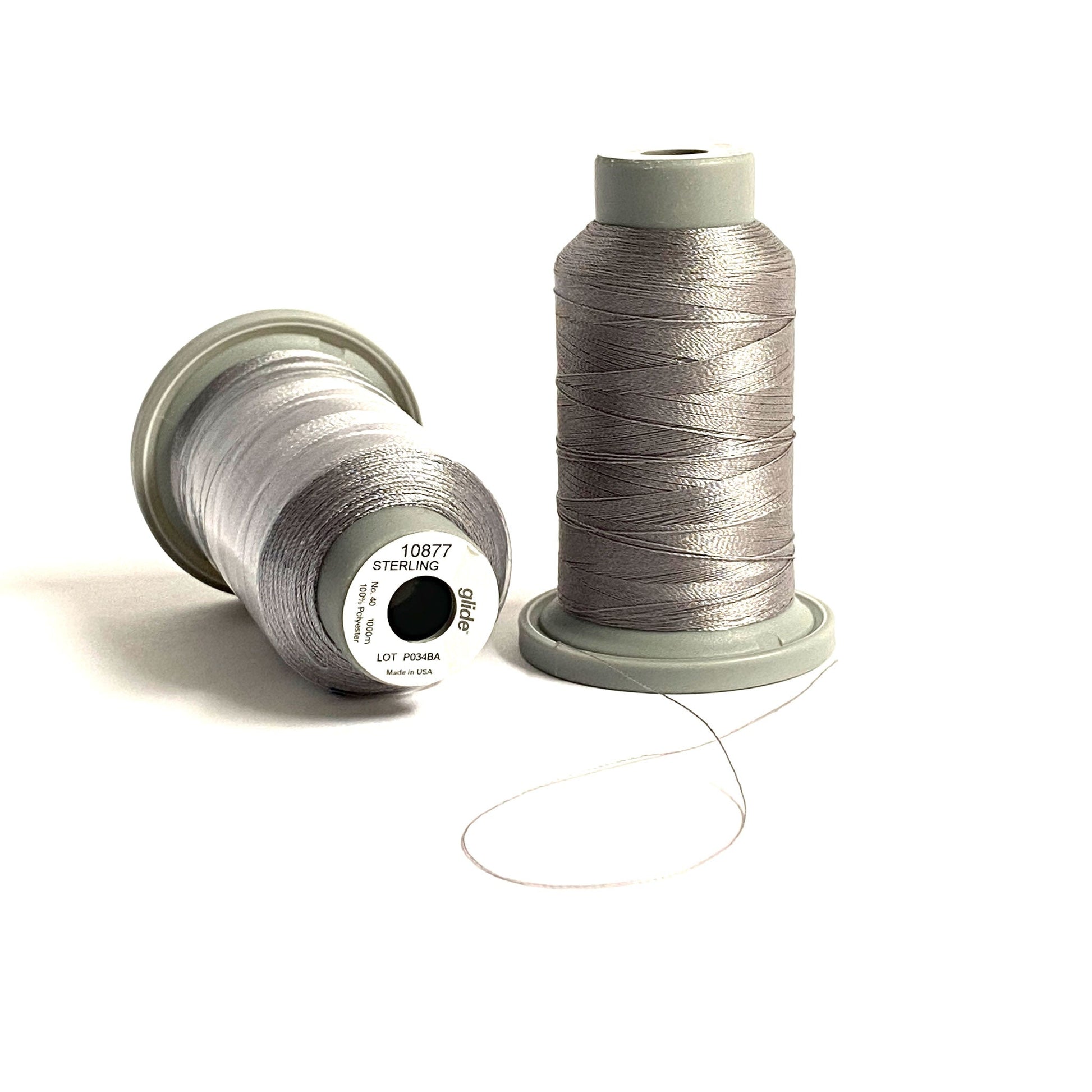 Glide 40 wt. Trilobal polyester thread by Fil-Tec is known for superior strength and coverage in each 1,100 yard mini spool. Sterling (10877) is a medium gray with a tinge of brown to give any project a weathered or aged look. Stitcher's Joy